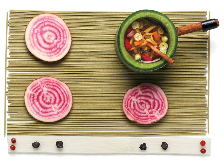 Illustration qui représente le dessus d’une cuisinière créée à partir de spaghettis et de tranches de betterave. Une casserole également faite de divers aliments est sur la cuisinière. 