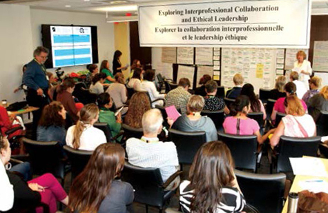 An image of College staff leading a seminar titled, 'Exploring Interprofessional Collaboration'.