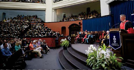 An image of College Registrar Michael Salvatori addressing graduating students during convocation at the University of Toronto.