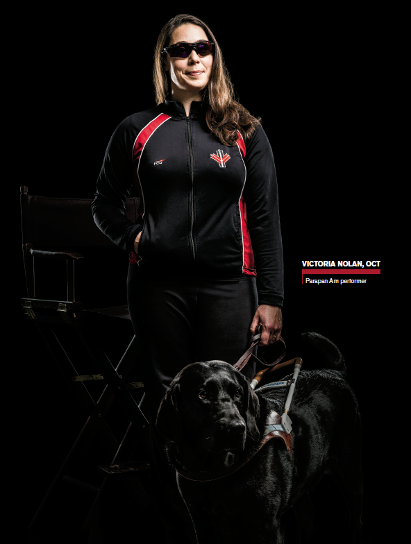 Photo of Victoria Nolan, Ontario Certified Teacher, with her black Lab guide dog.
