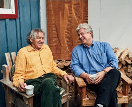 Photo of Author Linwood Barclay sitting and laughing with former Fenelon Falls Secondary School architecture teacher, John Boxtel, in Napanee, Ont.