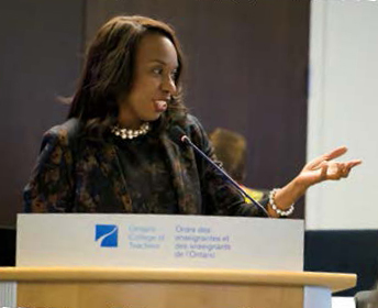 Photo of Ontario Education Minister Mitzie Hunter speaking at a podium.