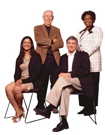 Photo of four members of The Royal Commission on Learning: Manisha Bharti, Dennis, Murphy, Gerald Caplan and Avis Glaze.