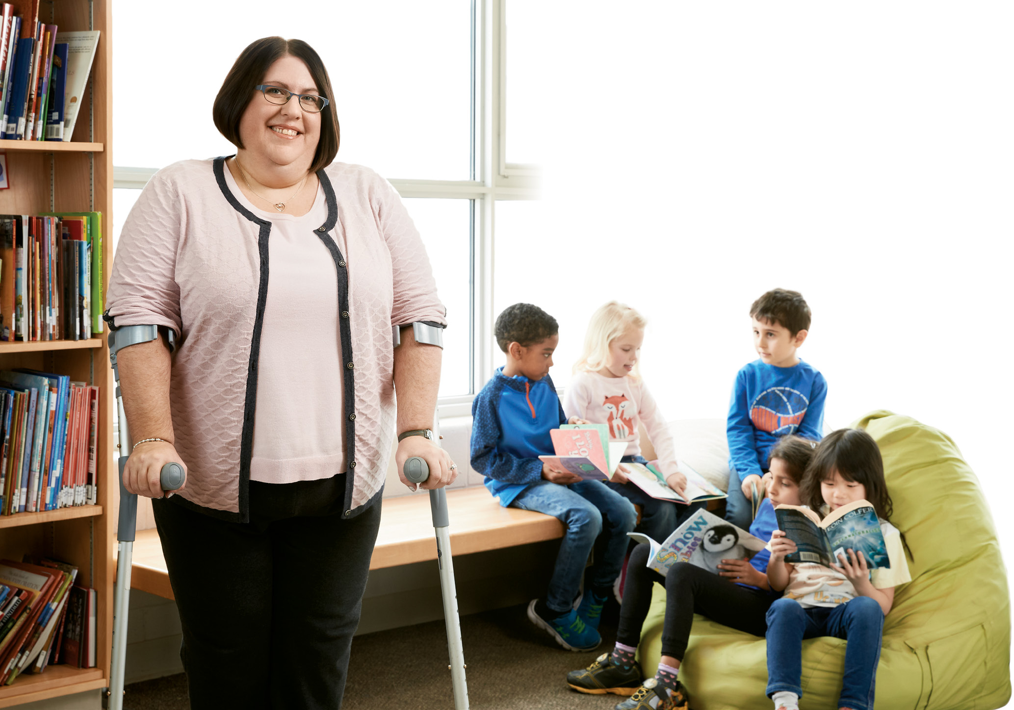 Photo of Kristin Plue, Ontario Certified Teacher, standing in a classroom.