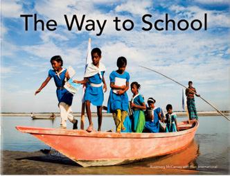 An image of the book cover for "The Way to School.” The cover image is a group of young people on a boat.