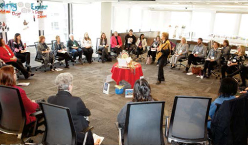Photo of a group of provincial AQ writers seated at a table during an AQ development consultation.