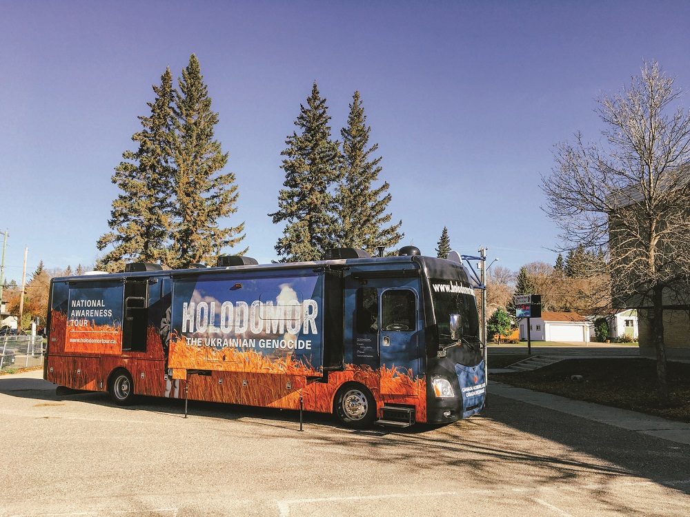 Photo of a company tour bus that says 'National Awareness Tour' and 'Holodomor the Ukrainian Genocide'.