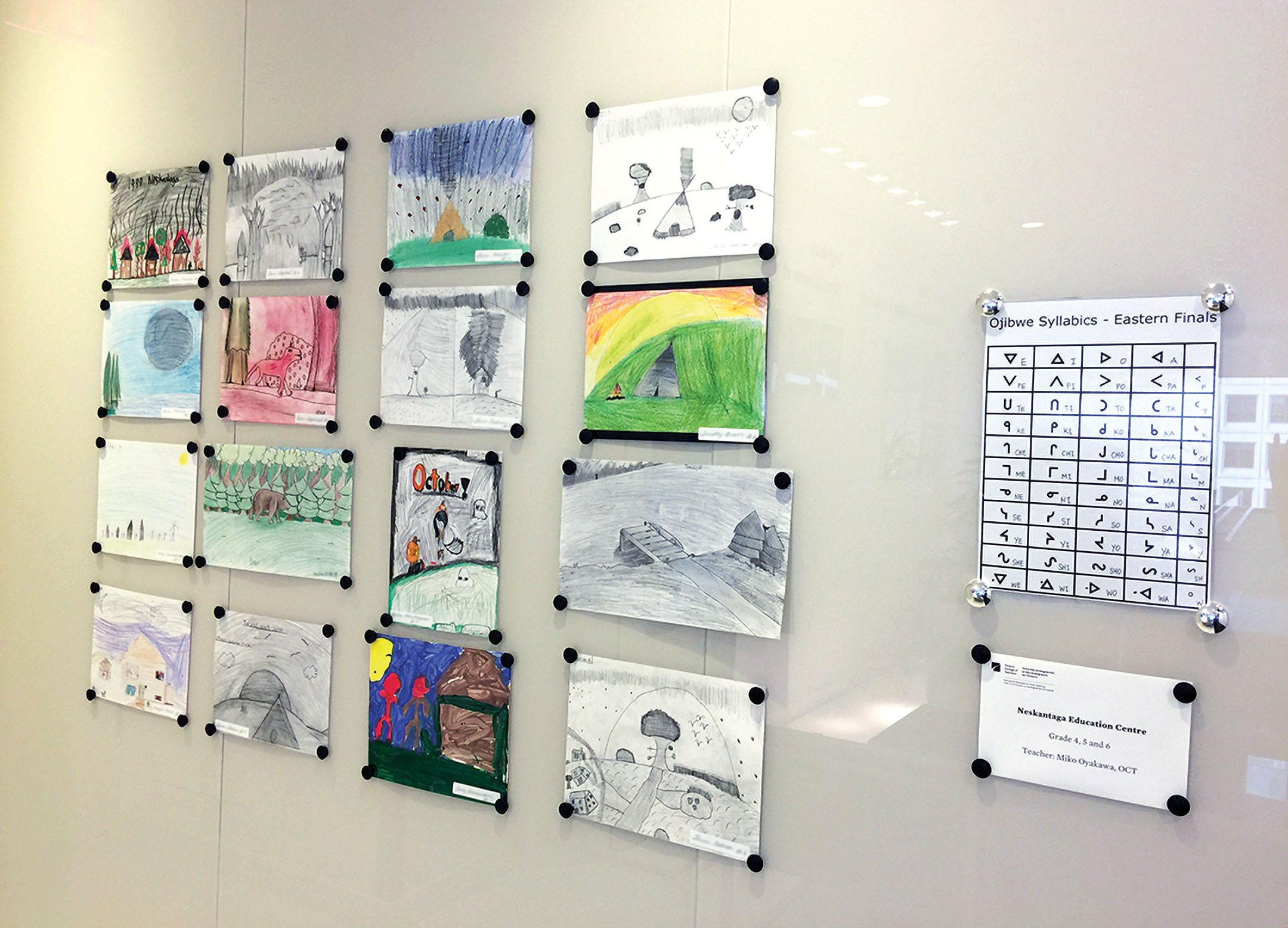 Photo of student artwork on the College's wall.