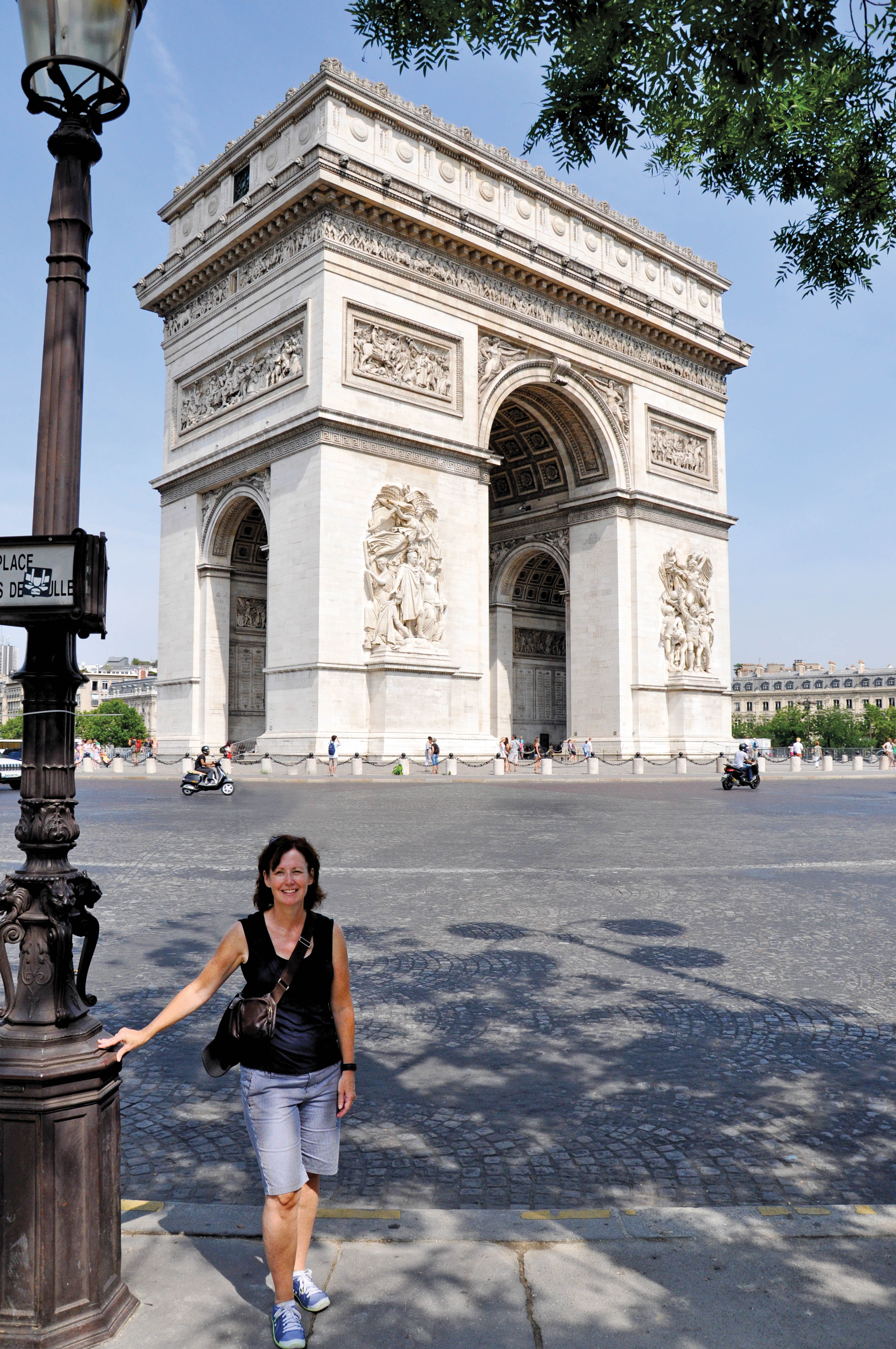 Nancy Malcolmson, OCT, poses outside the Arc de Triomphe in Paris